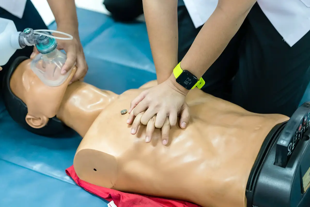 Basic Life Support of Demonstrating chest compressions on CPR doll