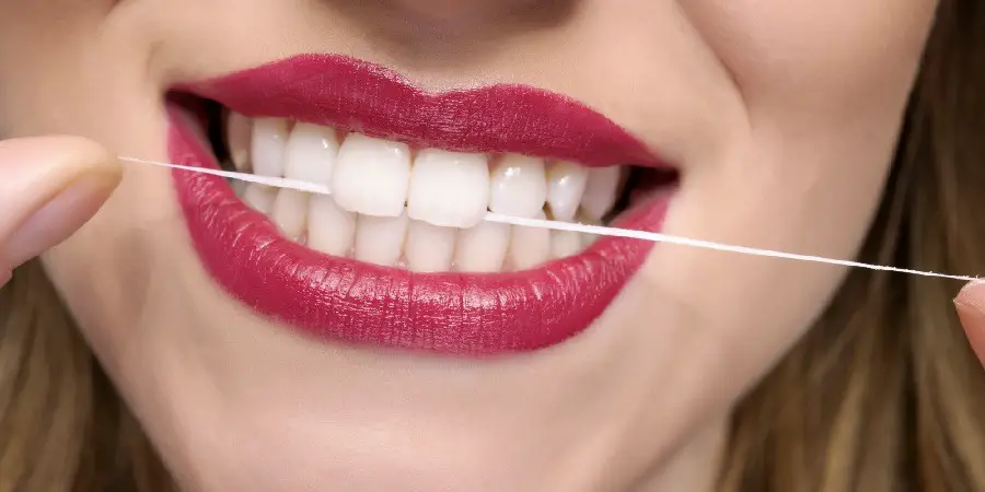 flossing floss teeth enough regularly huffingtonpost source