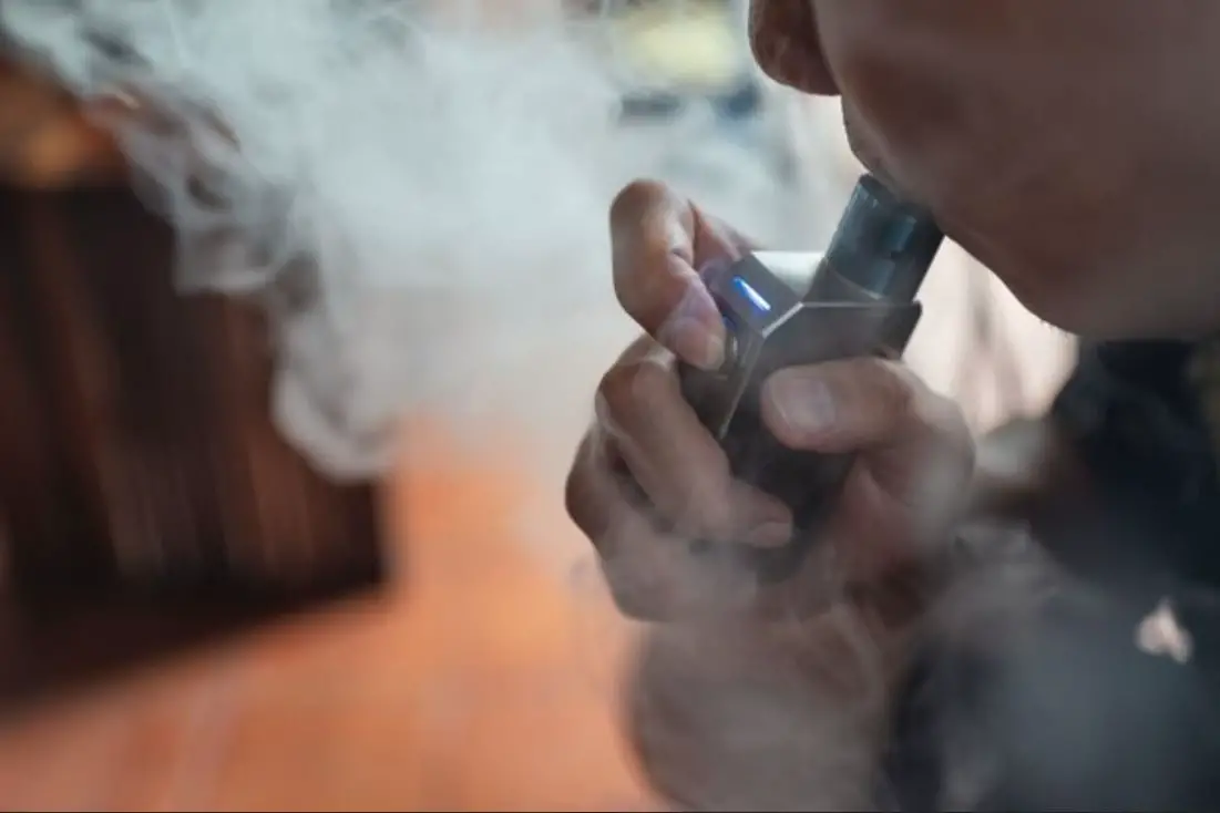 man-vaping-electric-cigarette-with-vapors