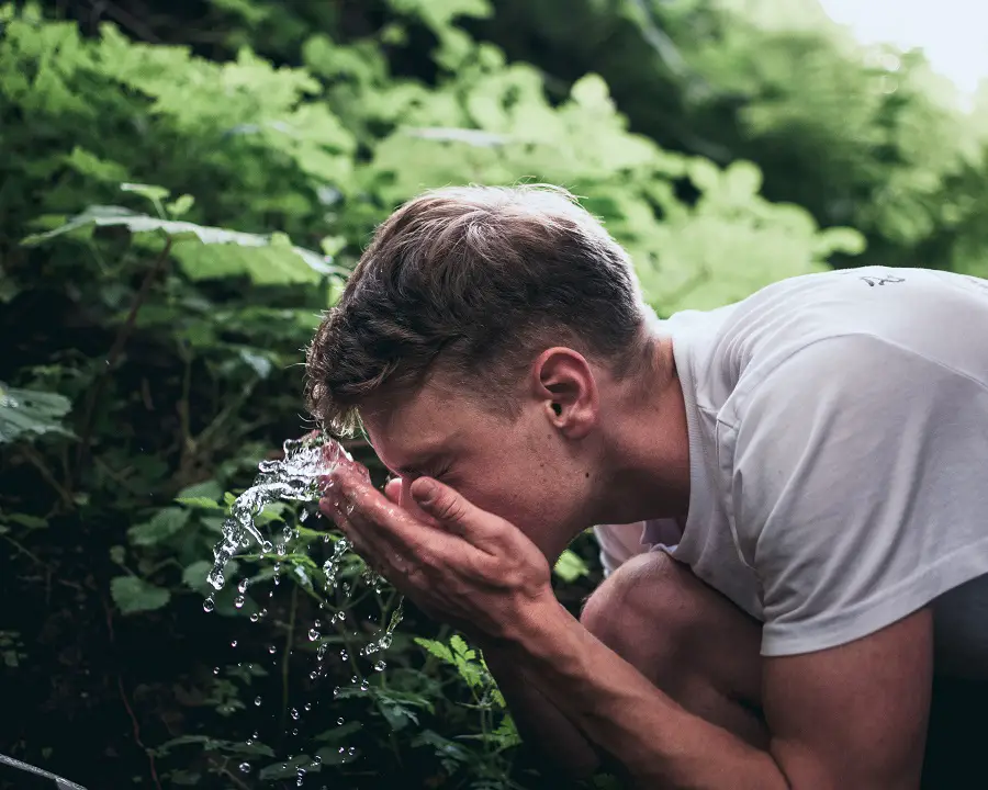 man-washing-face