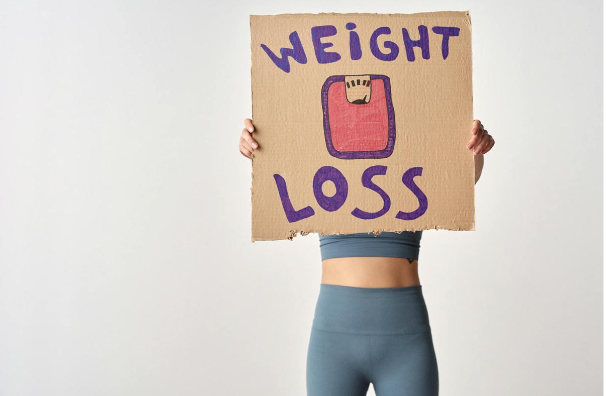 weight-loss-woman-sign