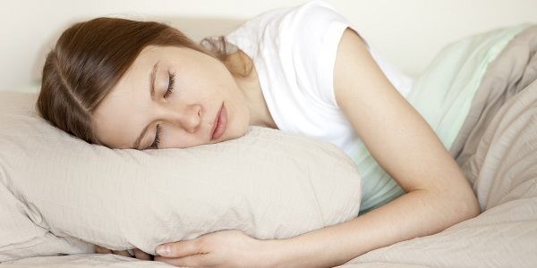 woman sleeping on a pillow