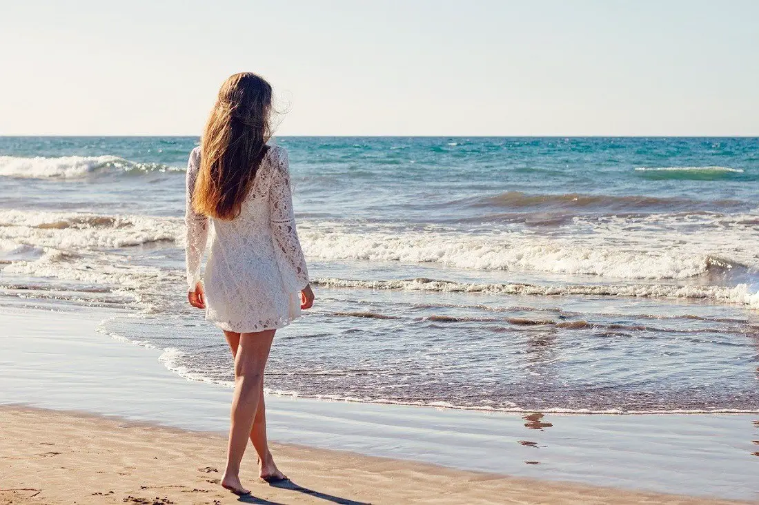 young-woman-beach-sand